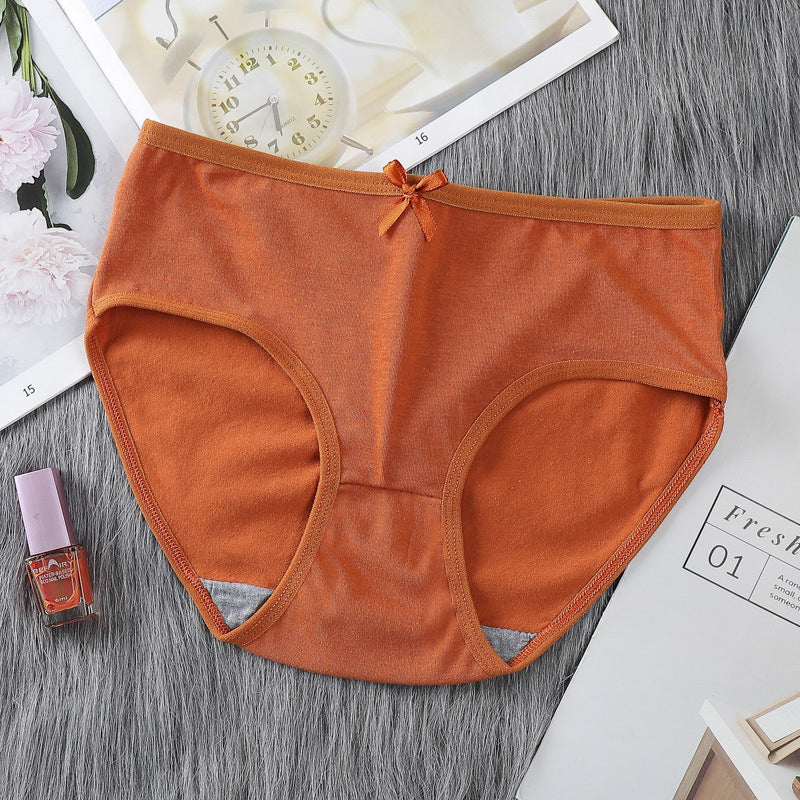 Figi dziewczęce o średnim stanie z elastycznymi bokami Tomiko Pomarańczowy