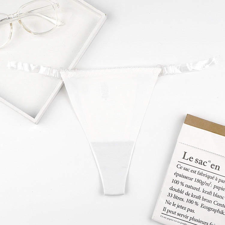 Stringi z przezroczystymi paskami i eleganckim detalem Iva Biały