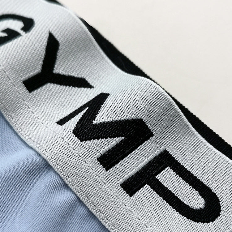 Stringi sportowe z elastycznego materiału na treningi Ayla