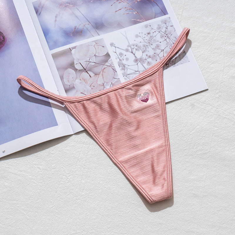 Stringi z wysokim wycięciem idealne pod obcisłe ubrania Domiziana Różowy